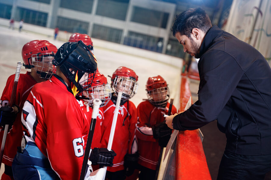 Hockey coach drawing up plays